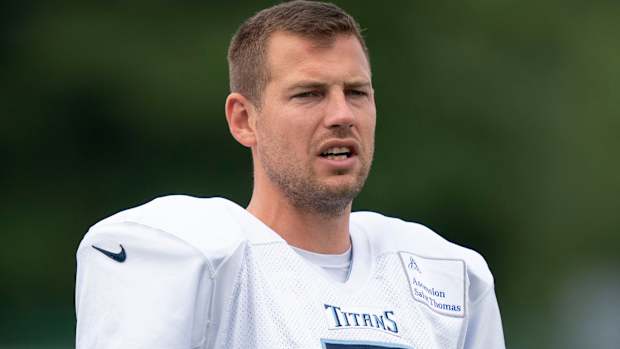 Titans punter Brett Kern (6) warms up during a training camp practice.